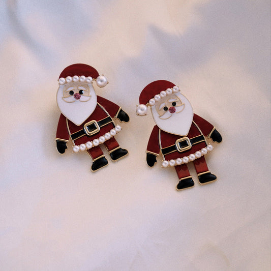 Kerstman oorstekers in rood en wit met witte kraaltjes langs muts en baard