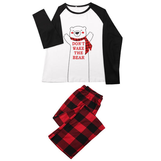 Familie kerstpyjama met wit-zwart shirt met ijsbeer en rood-zwart geruite broek
