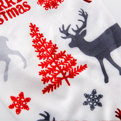 Kerstpyjama voor het hele gezin met kerstmanprint en witte rendierbroek