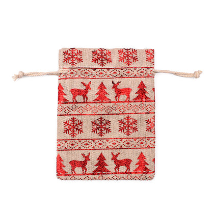 Kerstzakjes in jutelook met trekkoord en rode kerstprint met rendieren en sneeuwvlokken