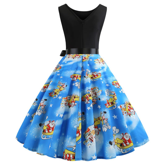 Mouwloze kerstjurk met zwart lijfje en blauwe rok met kerstman in de arrenslee