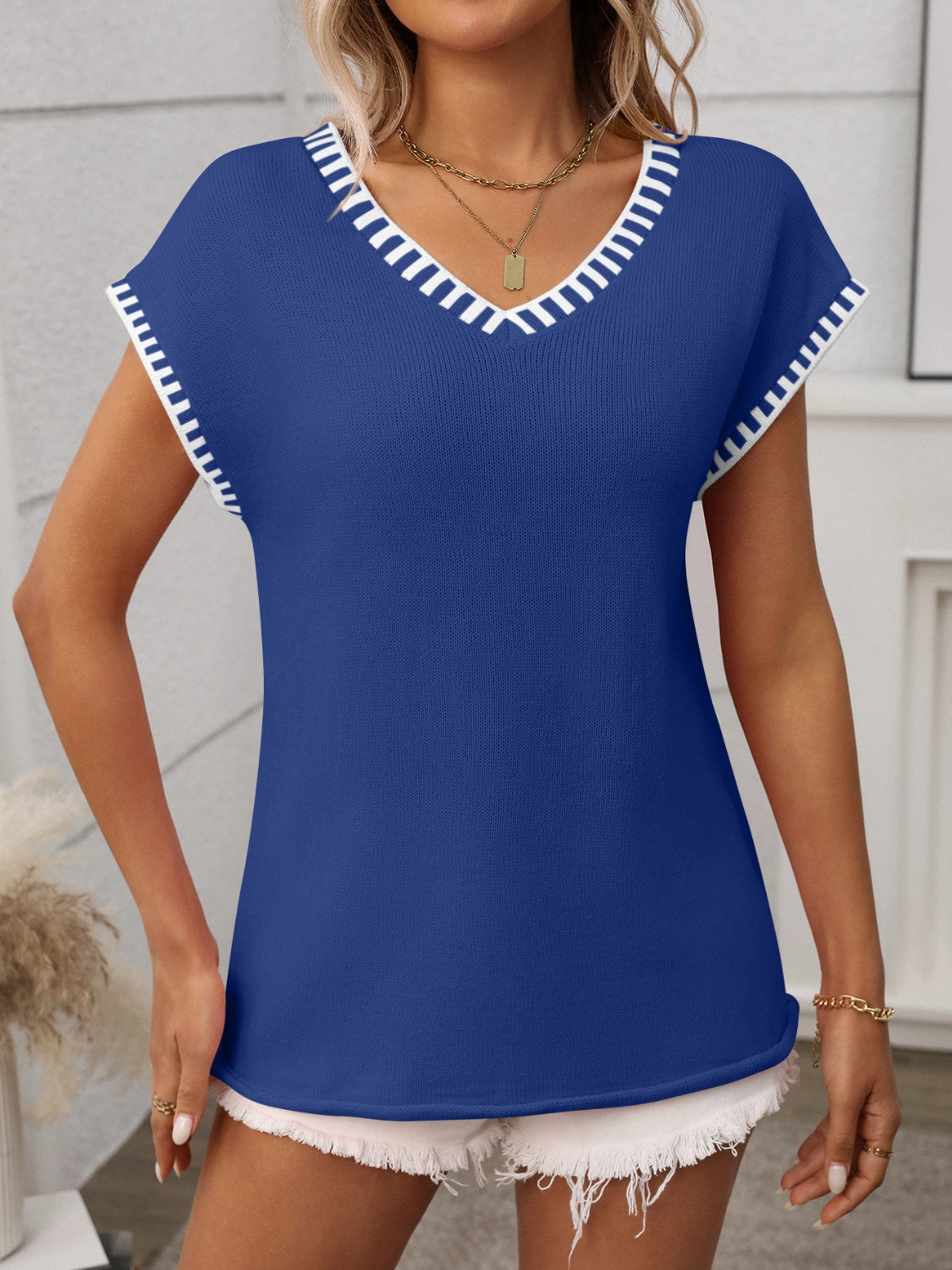 Gebreide top dames met contrastbies - detailfoto