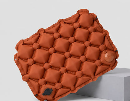 Opblaasbaar zitkussen - 90 gram, compact in oranje/bruin