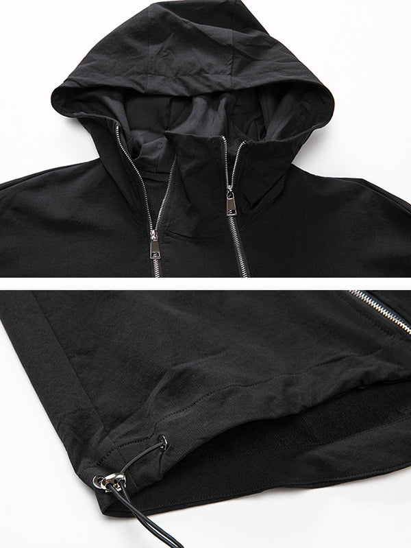 Oversized zwart damesjack met diagonale rits en capuchon