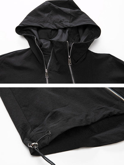 Oversized zwart damesjack met diagonale rits en capuchon