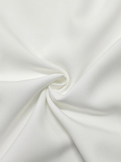 Witte lange damesblouse met volant op de taille en wijde halve mouwen