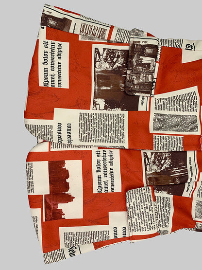 Damesblazer met krantenkolommen in rood en crème