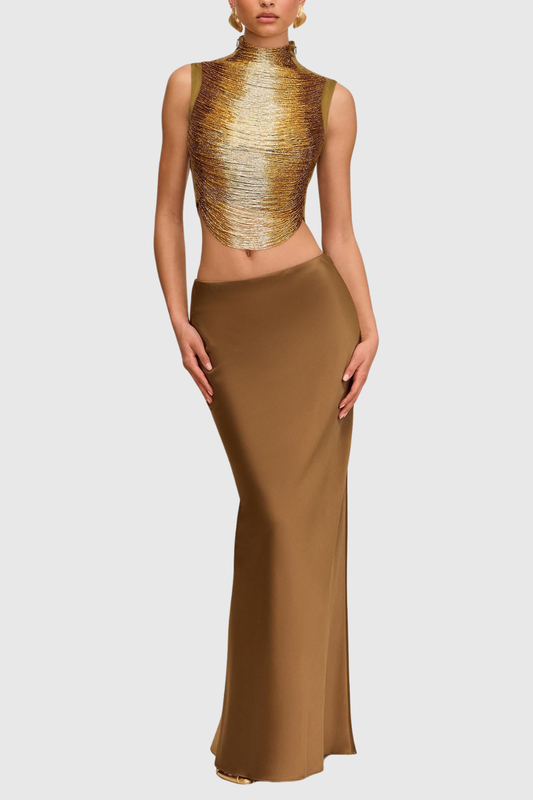 Gouden mouwloze top + jurk met hoge hals en glanzende structuur