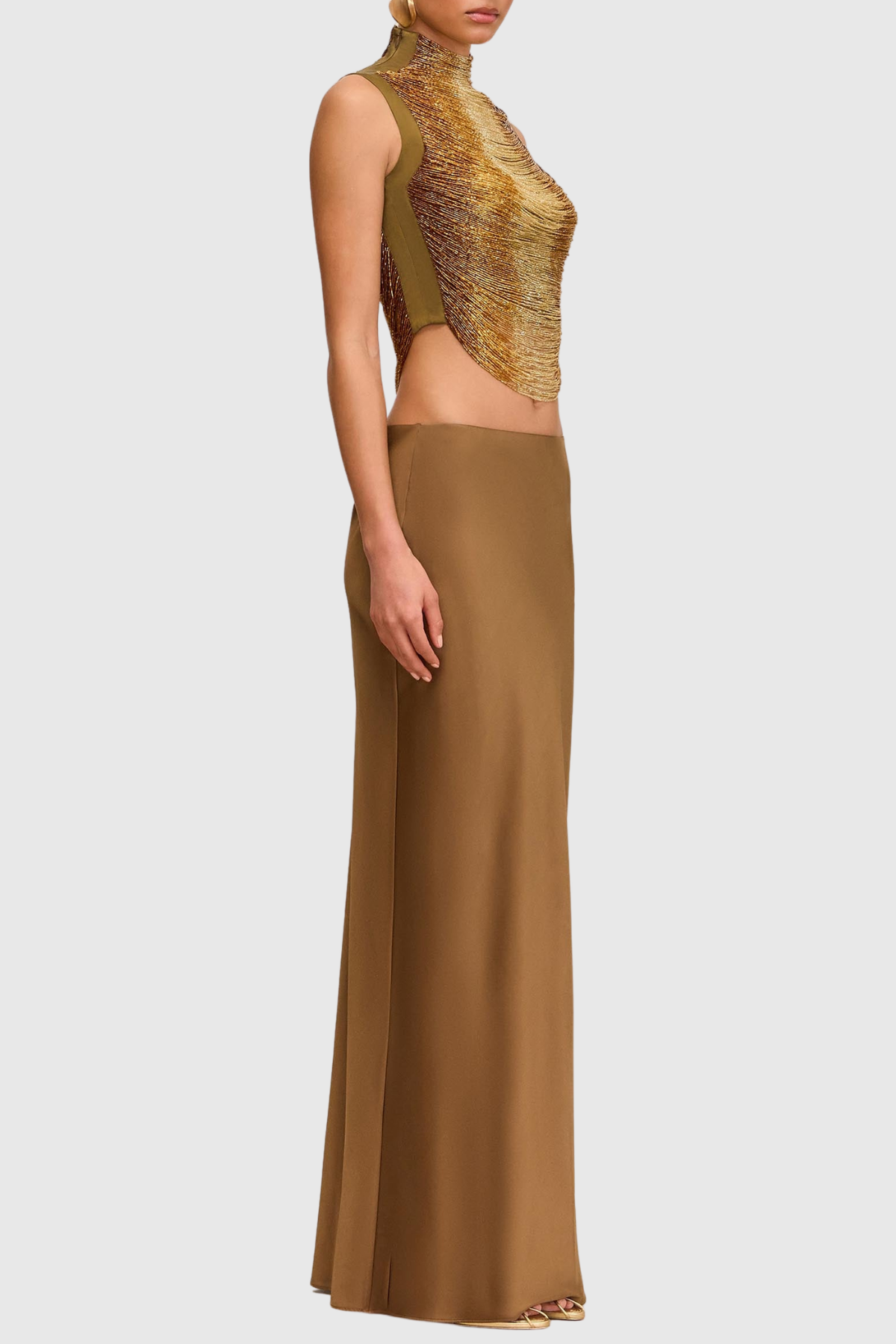Gouden mouwloze top + jurk met hoge hals en glanzende structuur