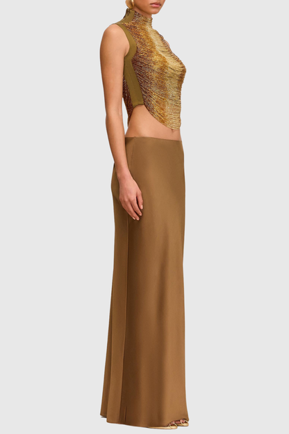Gouden mouwloze top + jurk met hoge hals en glanzende structuur