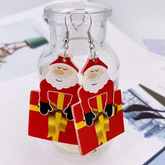 Druppelvormige kerstoorbellen van kunstleer met kerstprint aan oorhaakjes