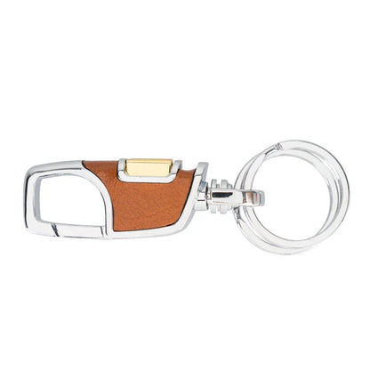 Leren sleutelhanger in cognac met verchroomde musketonhaak, messingkleurige duimknop en dubbele sleutelring