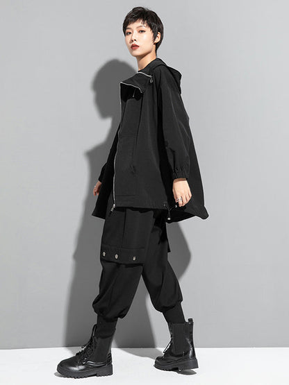 Oversized zwart damesjack met diagonale rits en capuchon