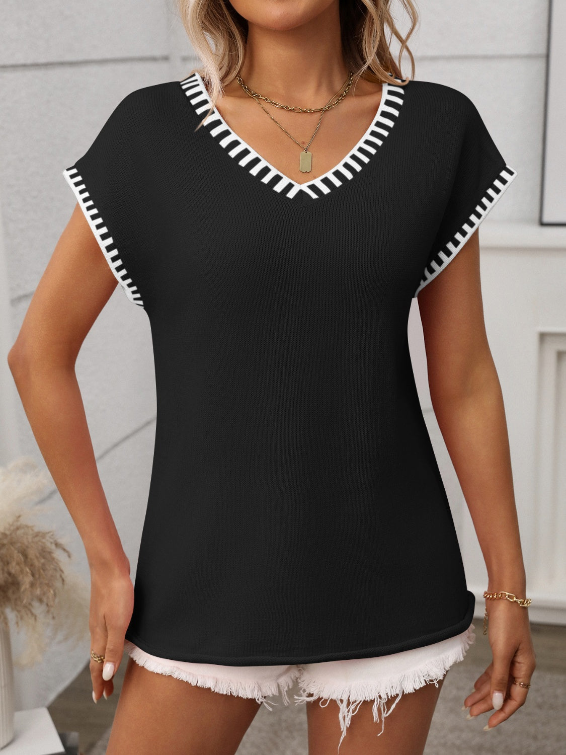 Gebreide top dames met contrastbies - detailfoto