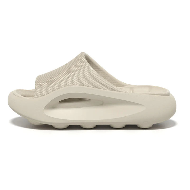 Badslippers van EVA met dikke zool, gevormd voetbed en brede band over de wreef - beige