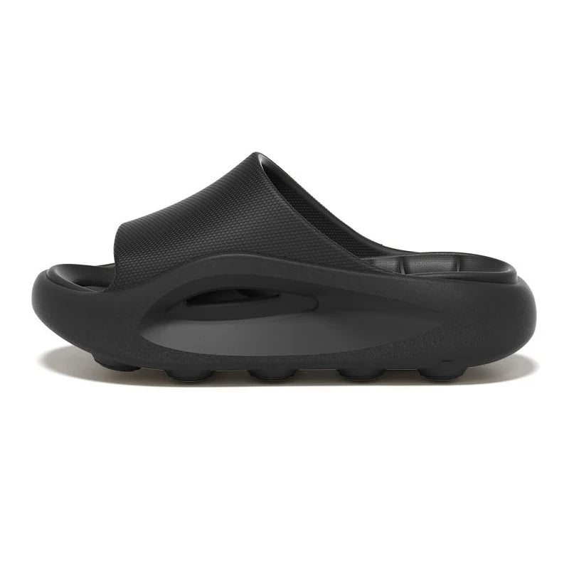 Badslippers van EVA met dikke zool, gevormd voetbed en brede band over de wreef - zwart
