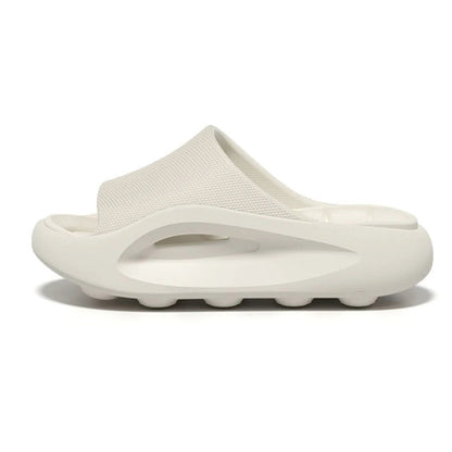 Badslippers van EVA met dikke zool, gevormd voetbed en brede band over de wreef - wit