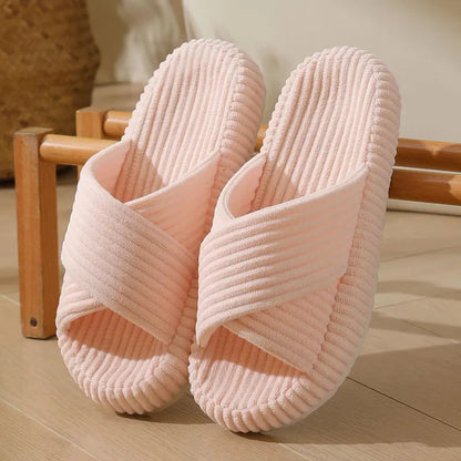 Open pantoffels van ribstof met gekruiste banden en dikke zool - roze