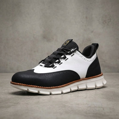 Brogue herensneakers in gladde leerlook met elastische veters door lusjes en profielzool - zwart met wit