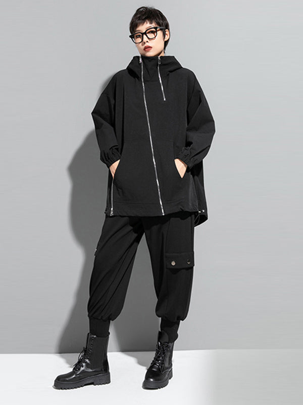 Oversized zwart damesjack met diagonale rits en capuchon