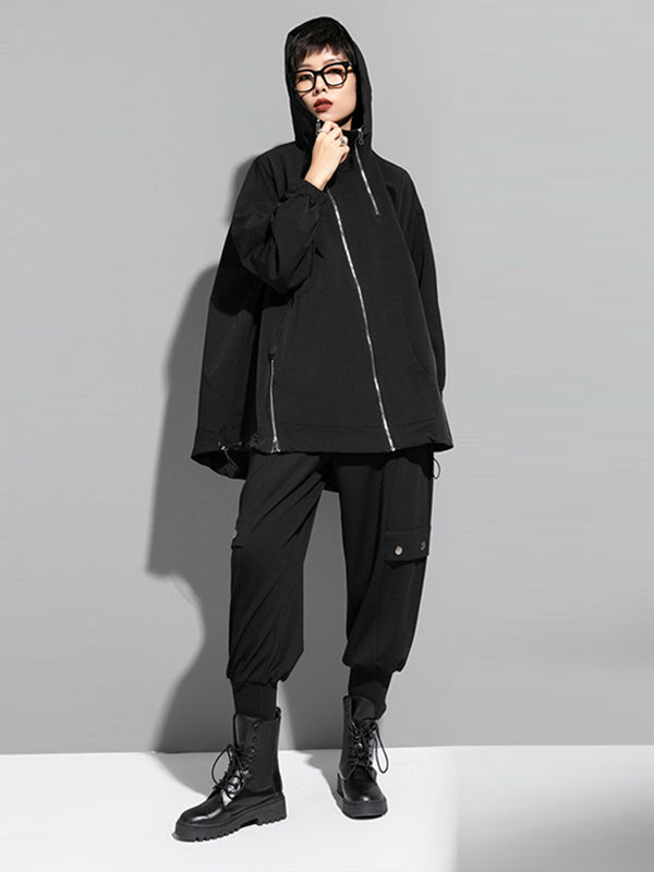 Oversized zwart damesjack met diagonale rits en capuchon