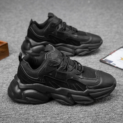 Chunky herensneakers met mesh, panelen in leerlook en suède look en dikke gelaagde zool - zwart