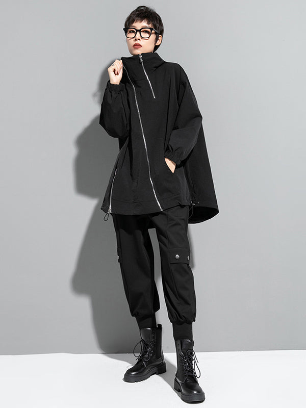 Oversized zwart damesjack met diagonale rits en capuchon
