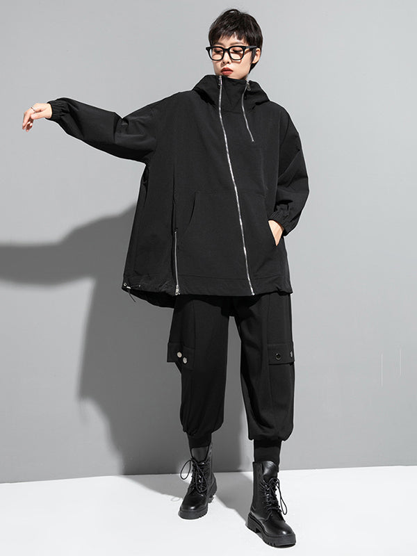Oversized zwart damesjack met diagonale rits en capuchon