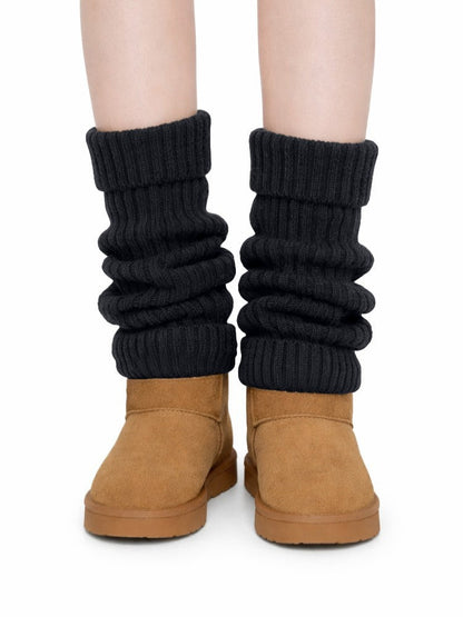 Gebreide beenwarmers voor dames in grove rib met omslagboord - zwart