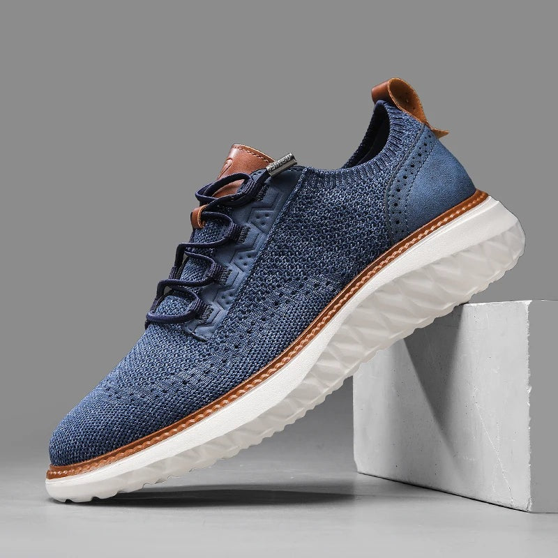 Gebreide herensneakers met brogue hielstuk in leerlook, elastische veters en witte zool met ruitreliëf - jeansblauw