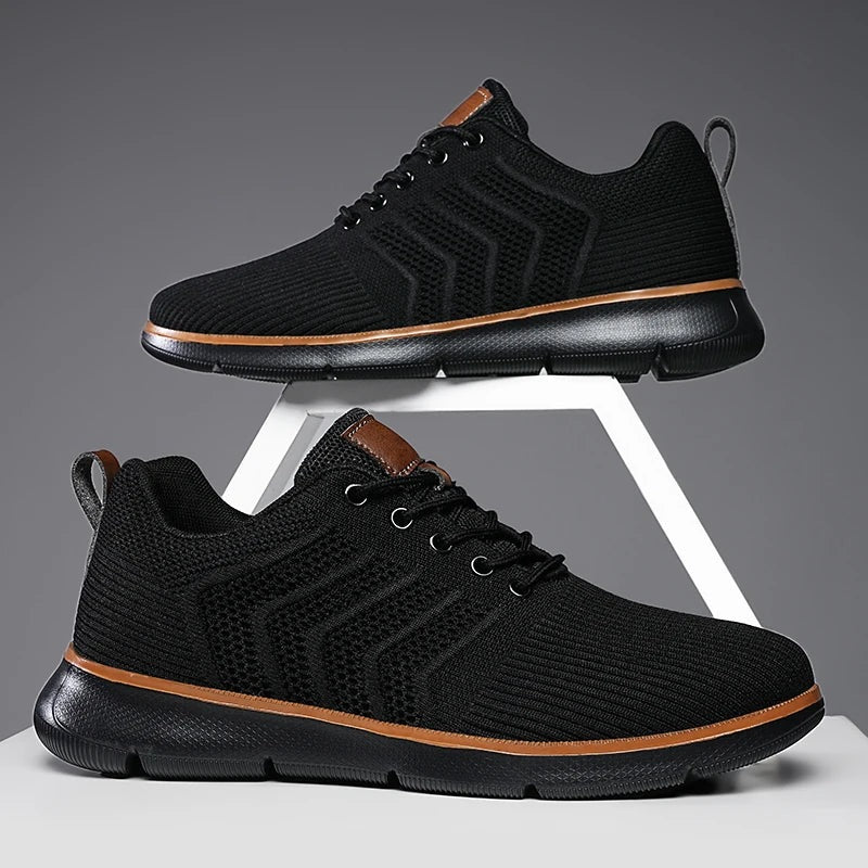Gebreide herensneakers met open chevronmotief, lichte zool en tabje in leerlook - volledig zwart