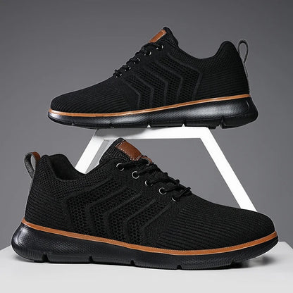 Gebreide herensneakers met open chevronmotief, lichte zool en tabje in leerlook - volledig zwart