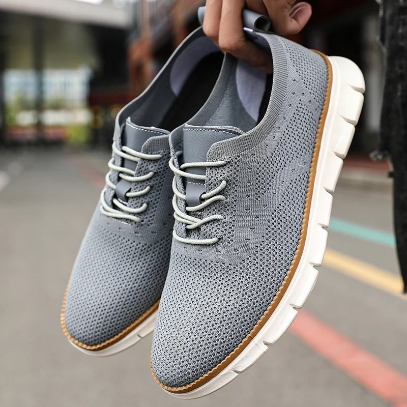 Gebreide herensneakers met vetersluiting in leerlook en lichte witte zool - lichtgrijs