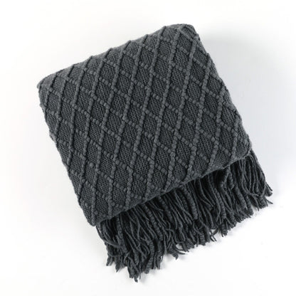 Gebreide plaid met Scandinavisch patroon en franjes over een stoel - antraciet