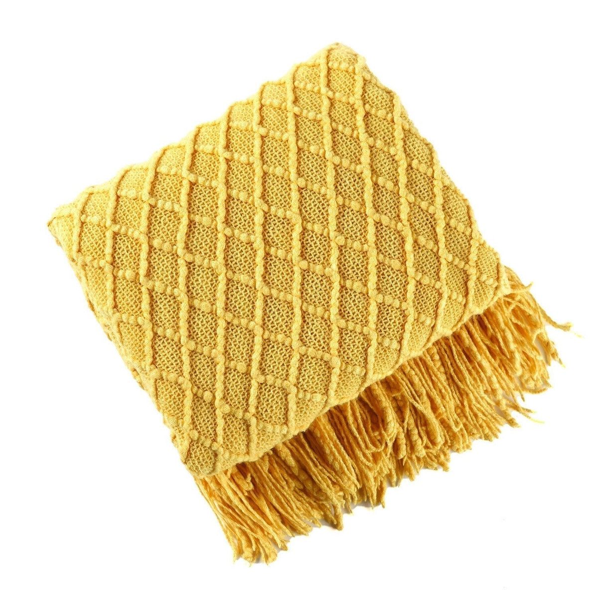 Gebreide plaid met Scandinavisch patroon en franjes over een stoel - goudgeel