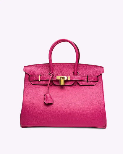 Handtas voor dames met twee ronde handgrepen, klep met draaisluiting en hangslotje - fuchsia