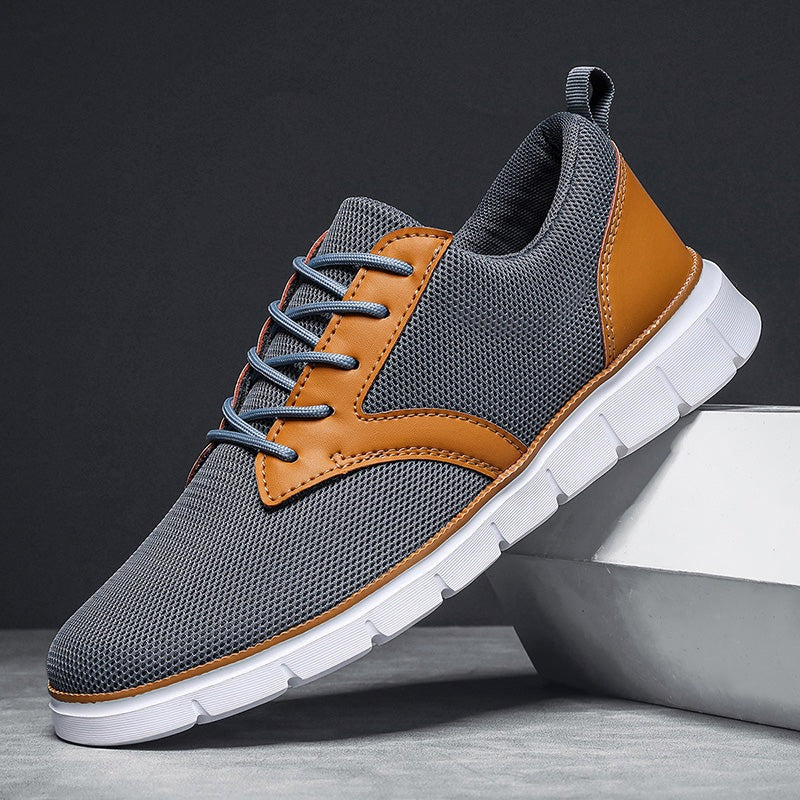 Herensneakers van mesh met zadelvormige inzet in leerlook, witte rubberen zool en hiellus - grijs