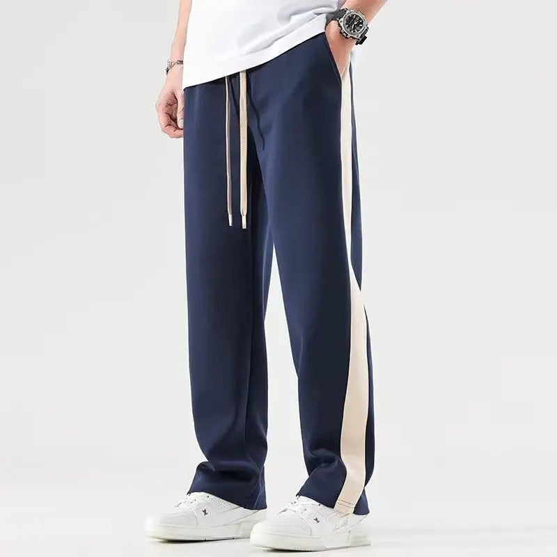Joggingbroek voor heren met brede contrastbies langs de pijp en trekkoord - marineblauw