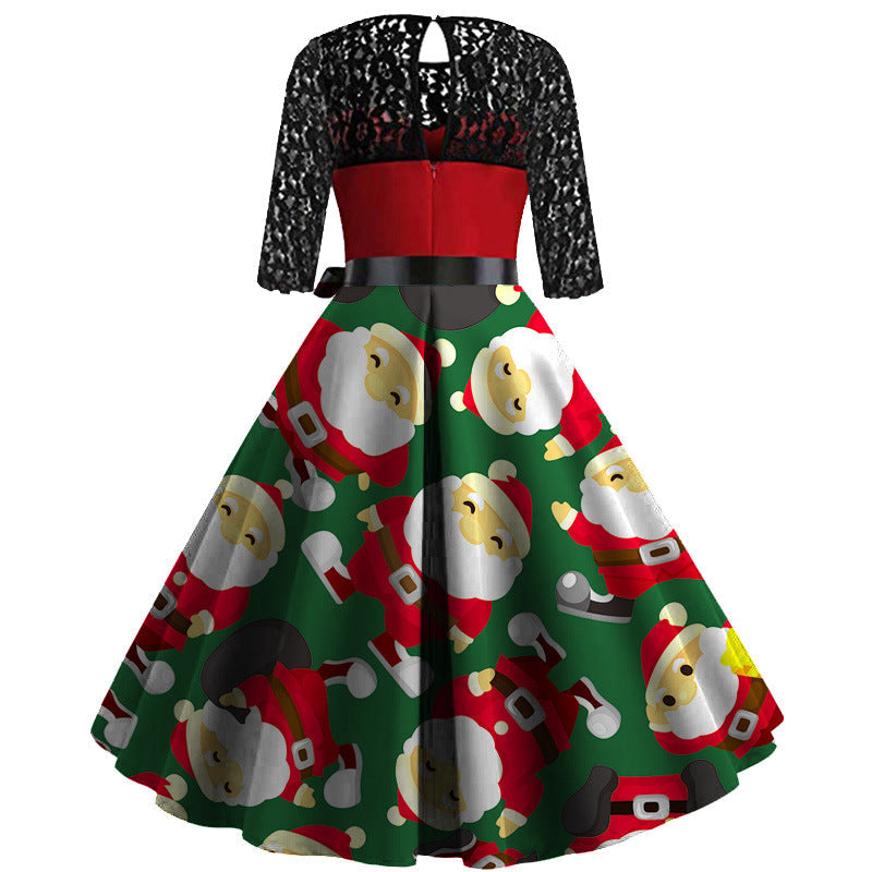 Kerstjurk met zwarte kanten mouwen, rood lijfje en wijde rok met kerstmanprint
