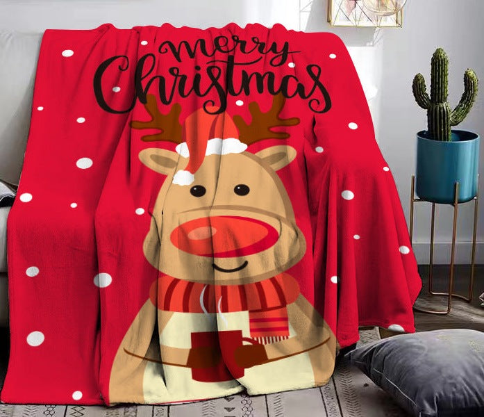 Fleece kerstplaid met kerstprint over een bank - rood met rendier