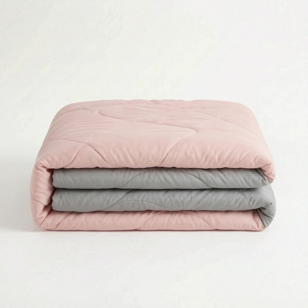 Licht koeldekbed zonder overtrek op een bed - roze/grijs