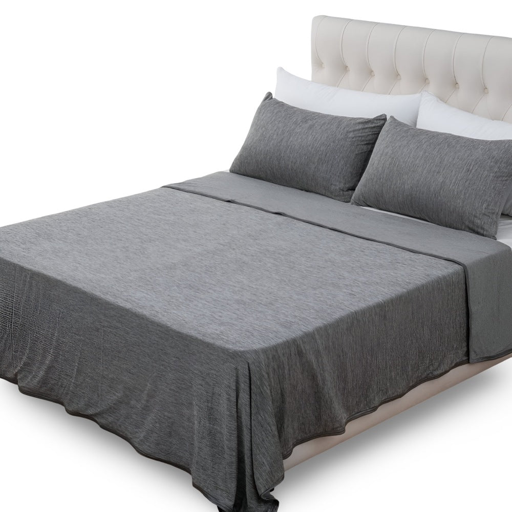 Koeldeken van katoen van 130 x 150 cm over een bed - grijs gemêleerd
