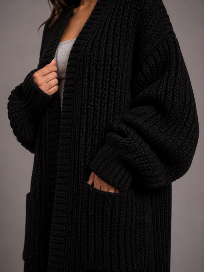 Lang oversized damesvest in grof breisel met open voorkant en zakken