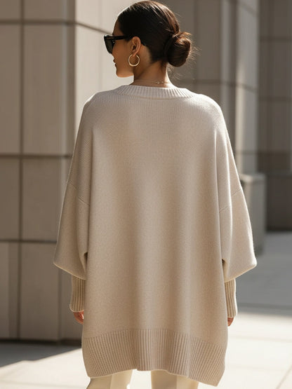 Lange oversized damestrui met brede mouwen en ribgebreide hals, manchetten en zoom - beige