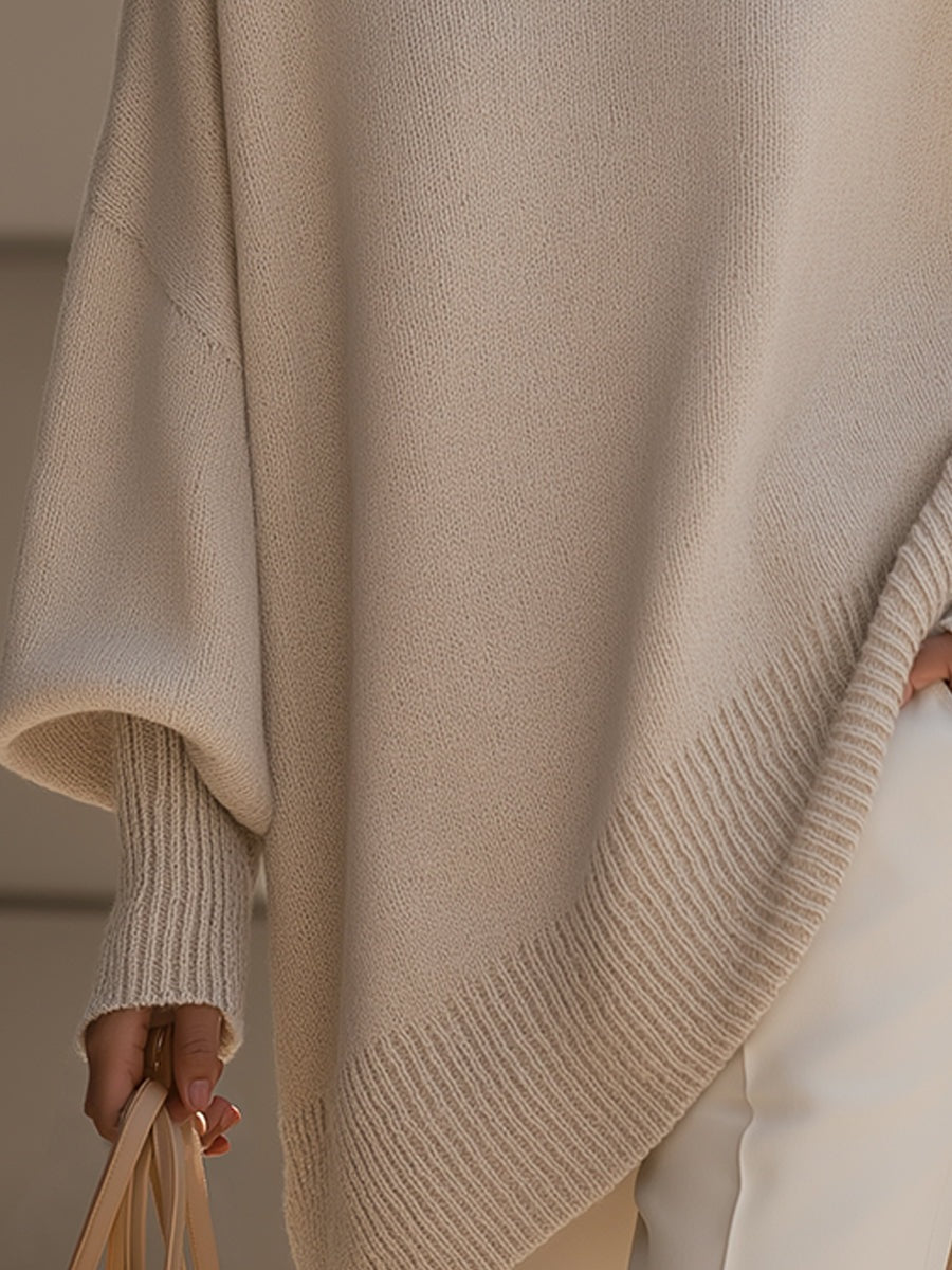 Lange oversized damestrui met brede mouwen en ribgebreide hals, manchetten en zoom - beige