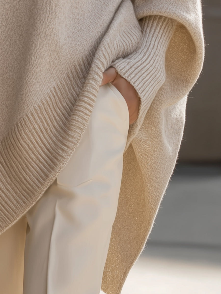 Lange oversized damestrui met brede mouwen en ribgebreide hals, manchetten en zoom - beige