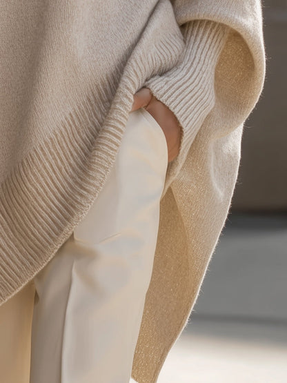 Lange oversized damestrui met brede mouwen en ribgebreide hals, manchetten en zoom - beige