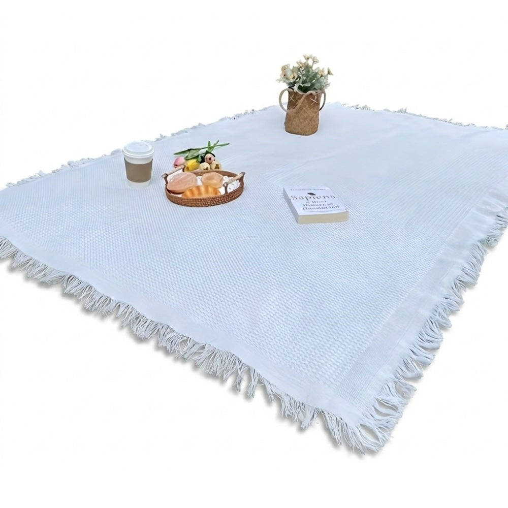 Picknickkleed van 180 x 180 cm met wafelstructuur en franjes op het gras - wit
