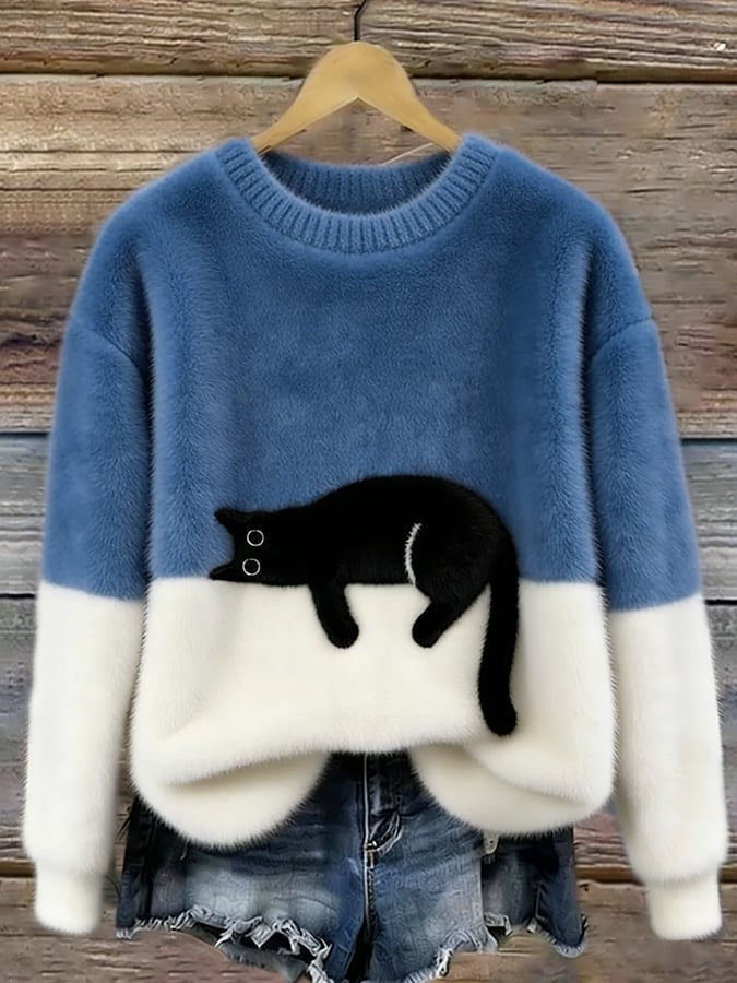 Pluizige damestrui met zwarte kattenprint en crèmewitte onderkant - blauw