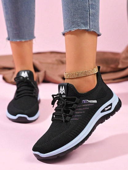 Sneakers voor dames met gebreid bovenwerk, elastische veters en dikke witte zool - zwart